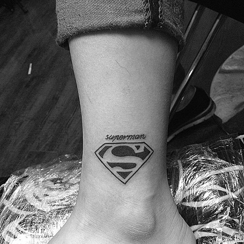 black and white superman tattoo