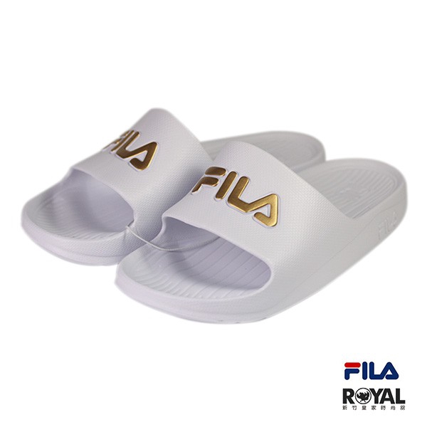 white and gold fila slides