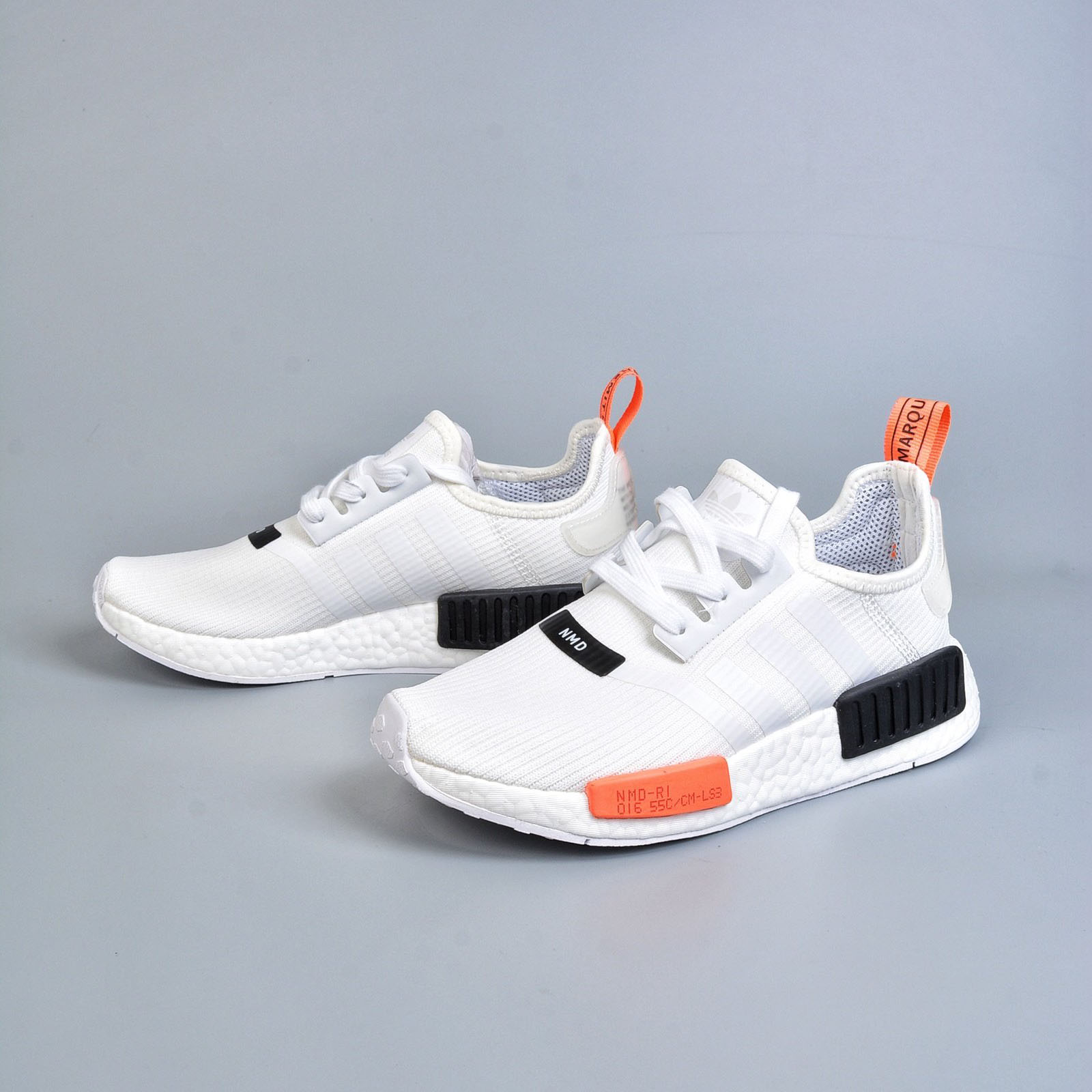 nmd r1 black orange white