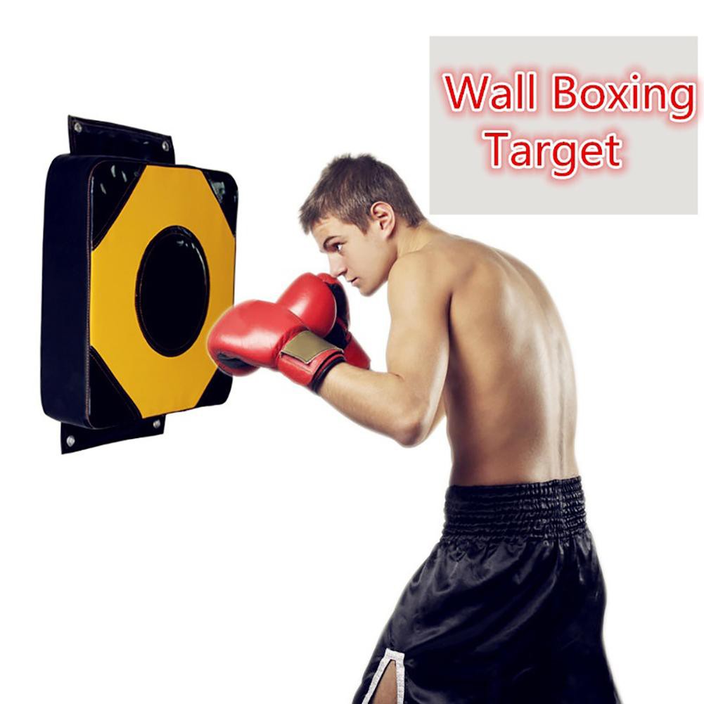 punching wall with boxing gloves