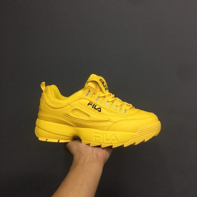 blue and yellow fila shoes
