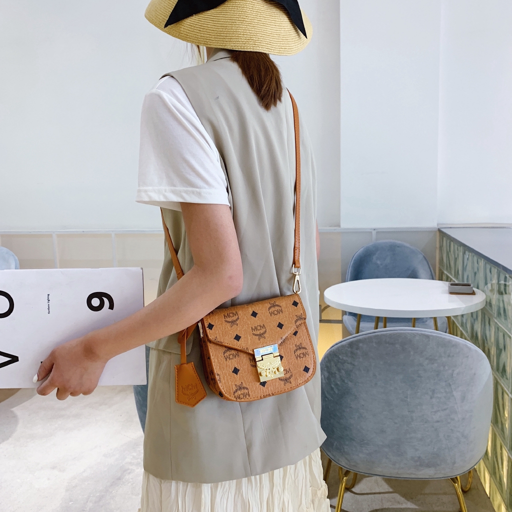 mcm mini sling backpack