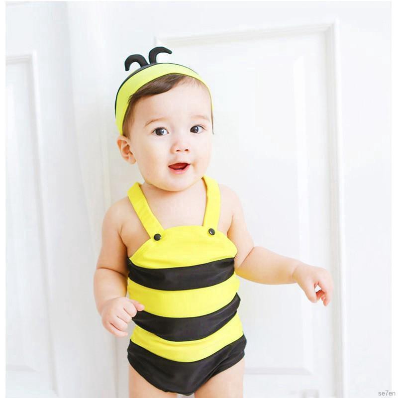 little boy in girl swimsuit