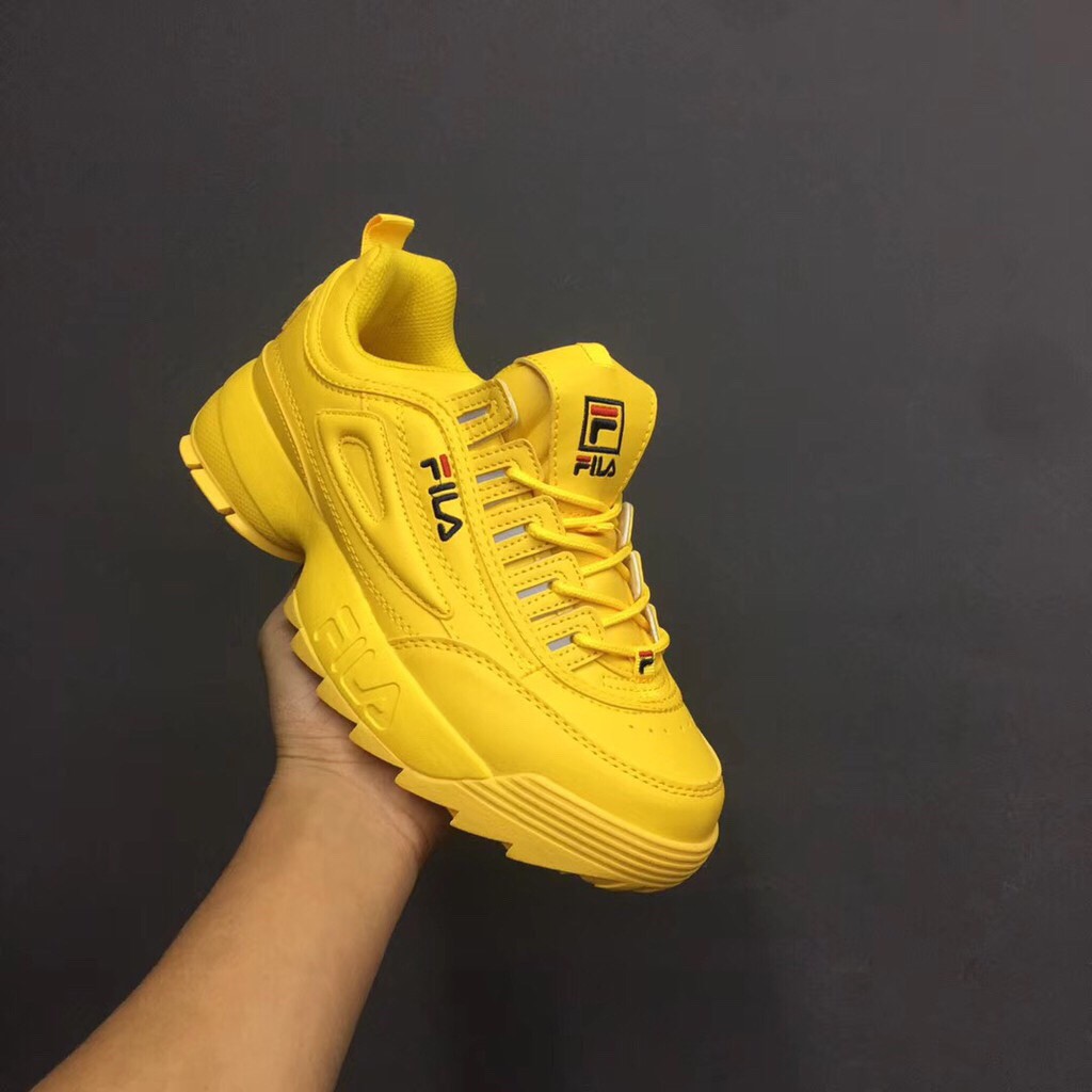 all yellow fila shoes