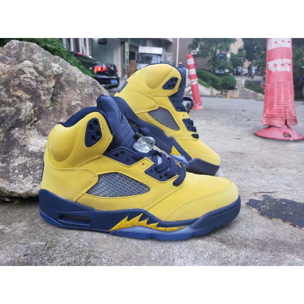 navy and yellow basketball shoes