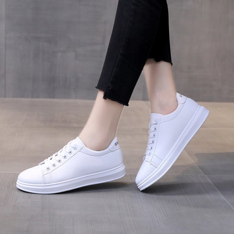 solid white sneakers