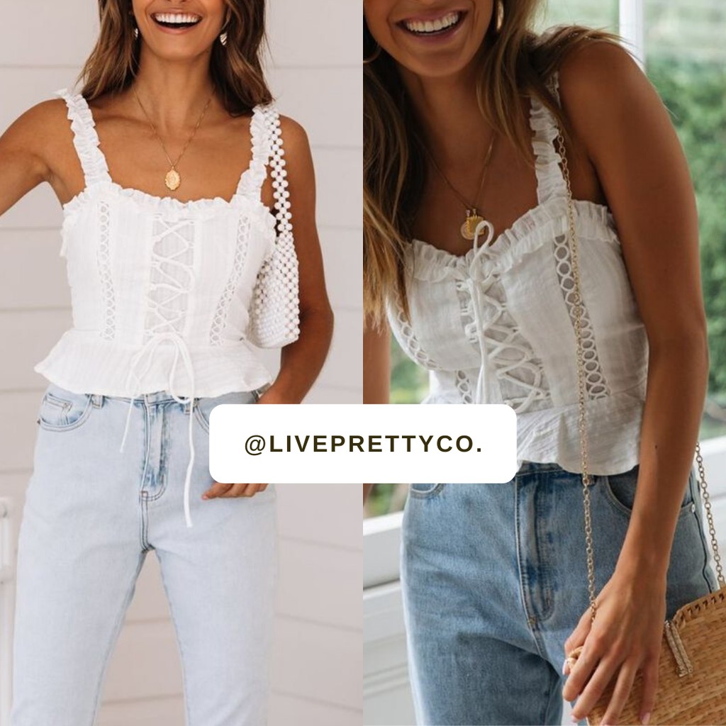 white sleeveless ruffle top