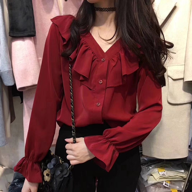 red blouse with ruffle sleeves