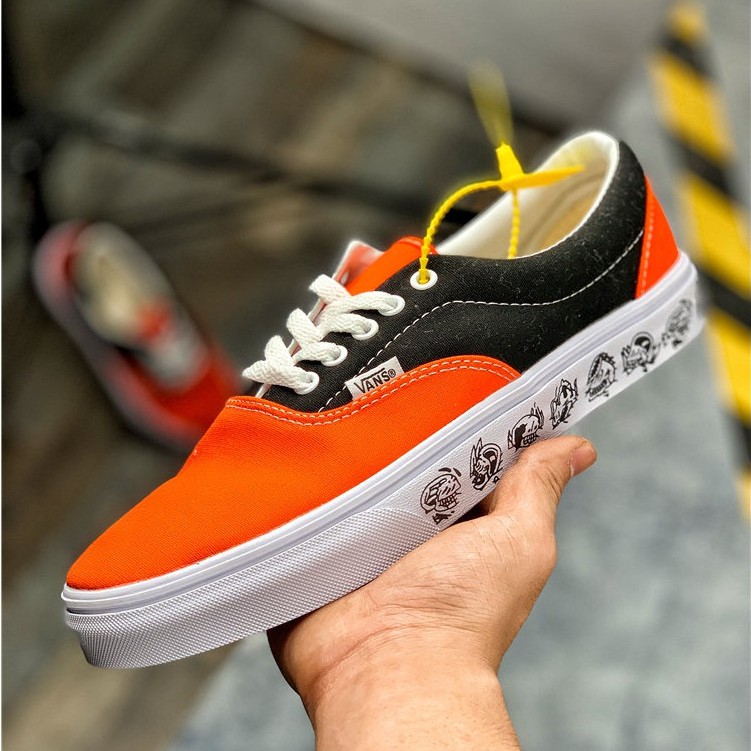 orange and black vans