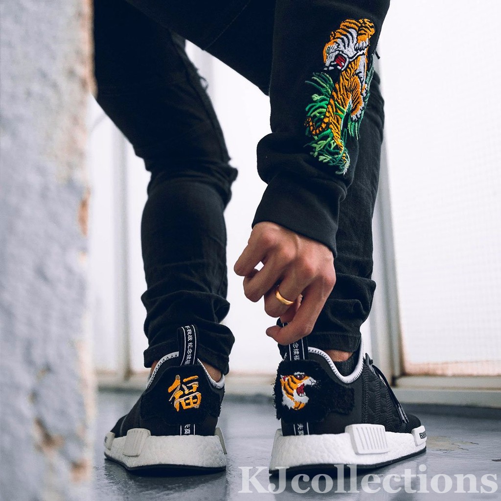 nmd x invincible x neighbourhood