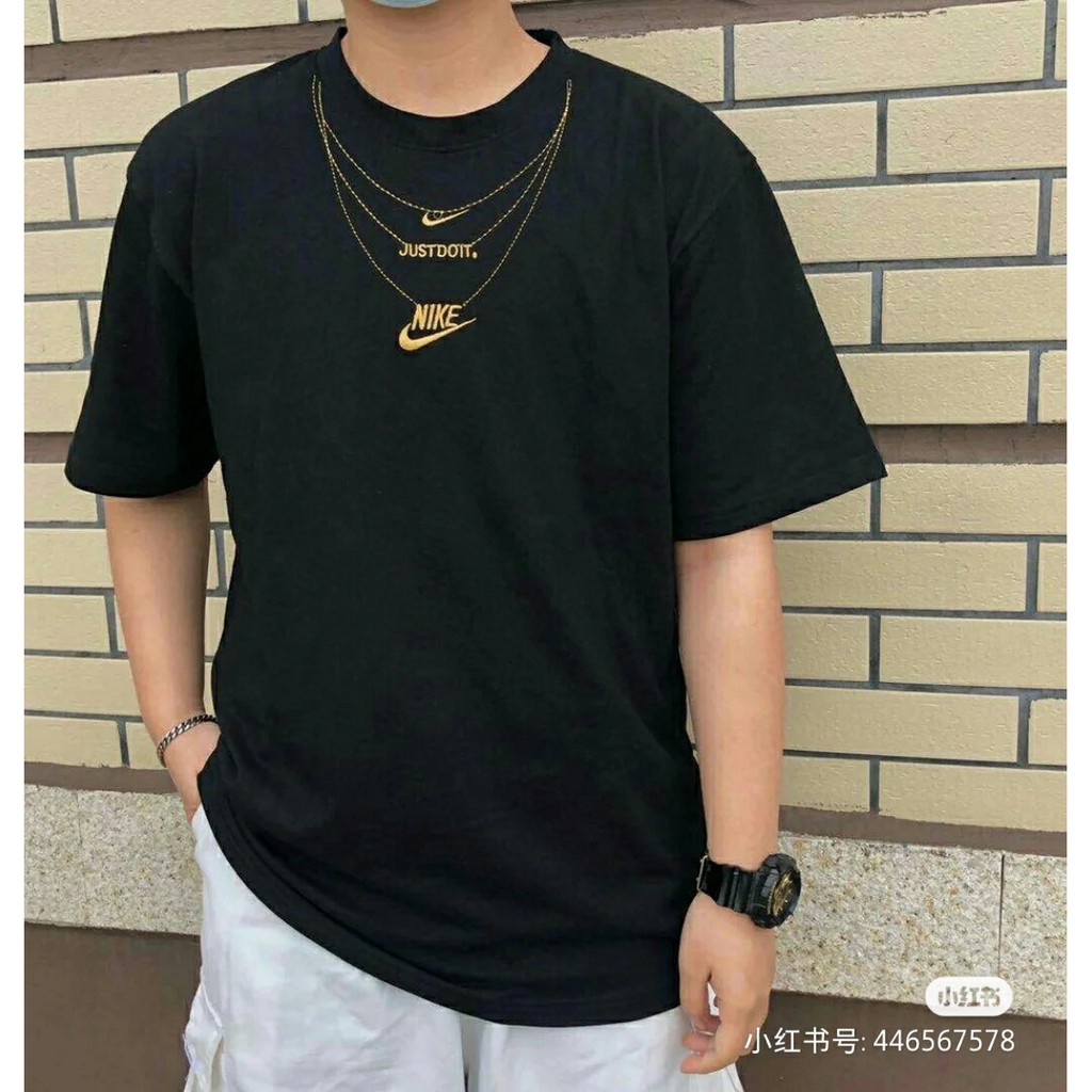 gold nike shirt mens