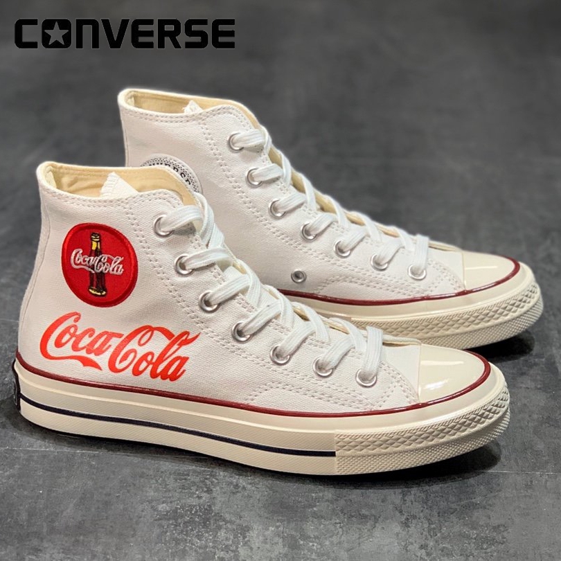 white converse with red letters