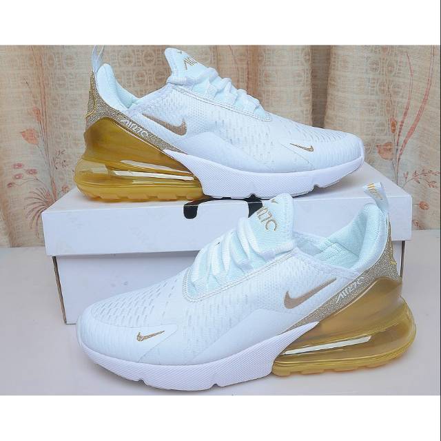 white and gold nike 270