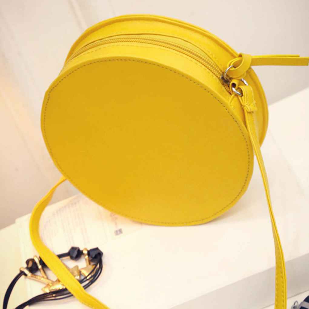 yellow round crossbody bag