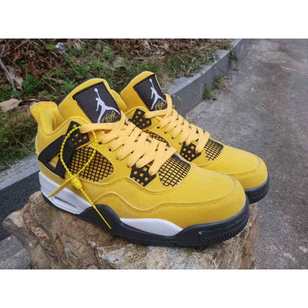 yellow black jordan 4