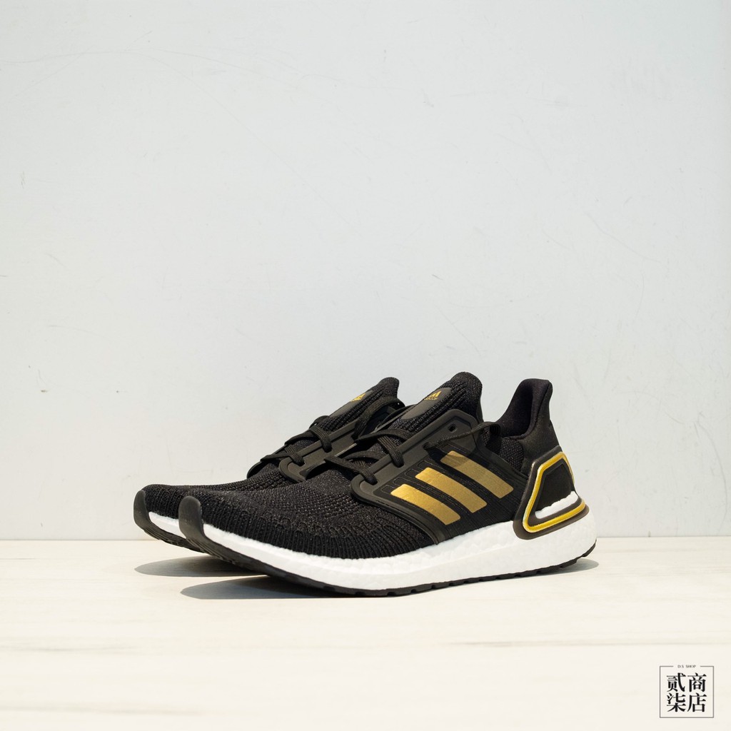 gold and black running shoes