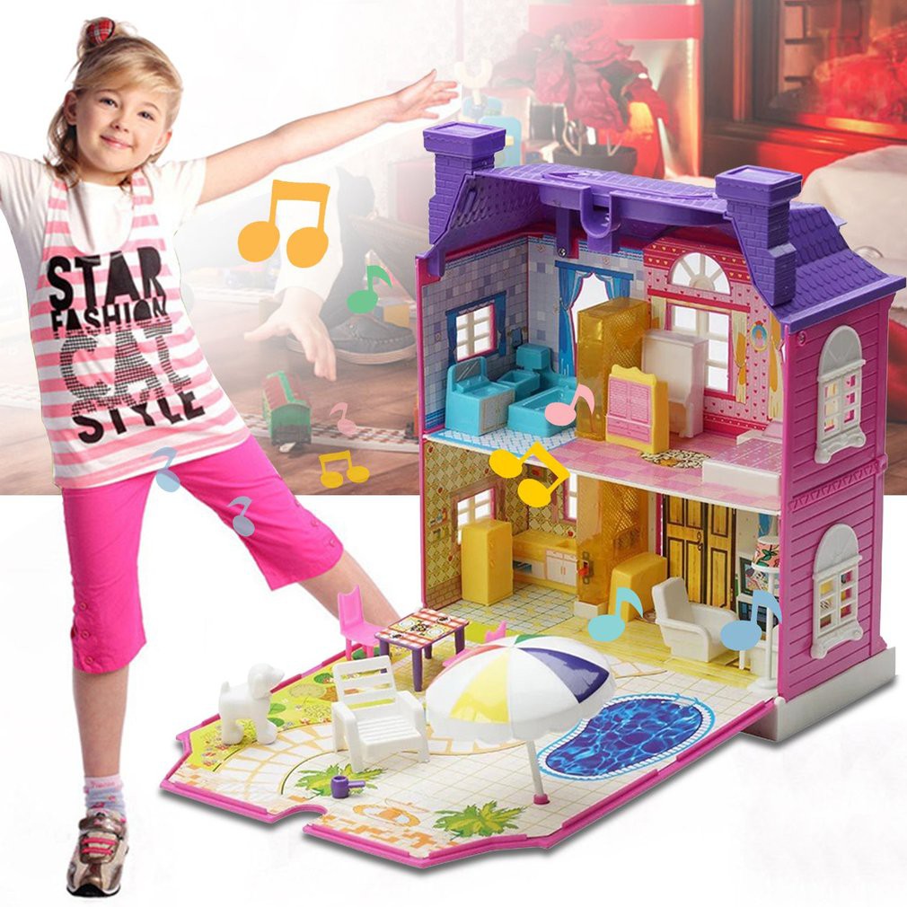 girl playing with dollhouse