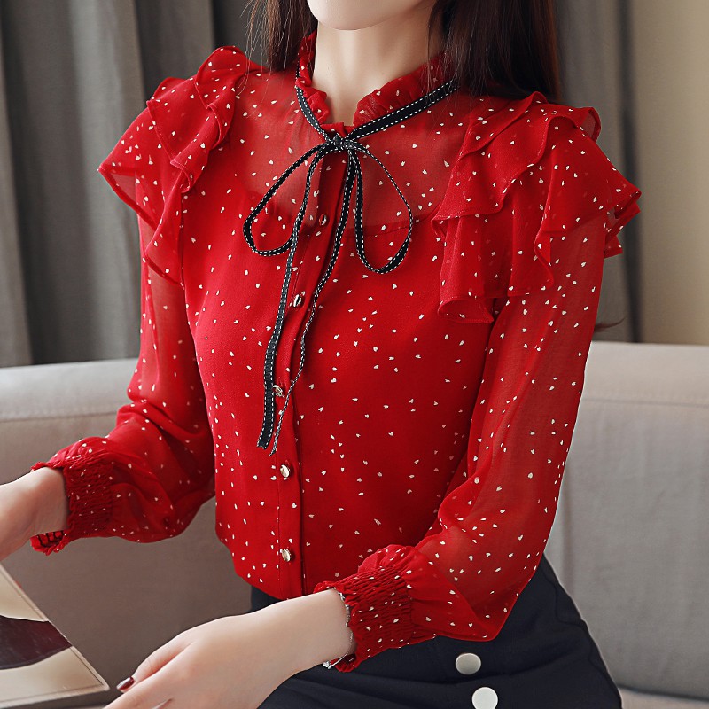 red blouse with black polka dots