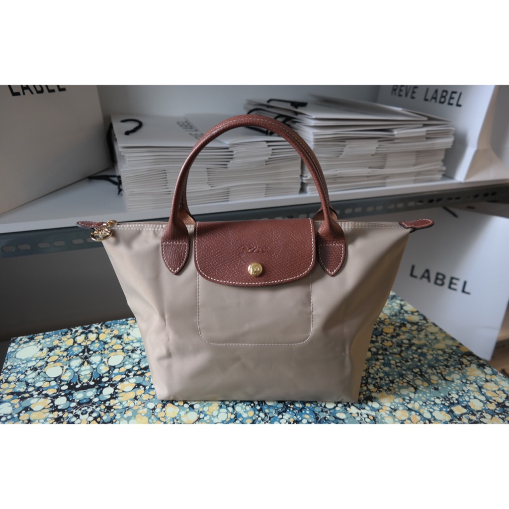 beige longchamp bag