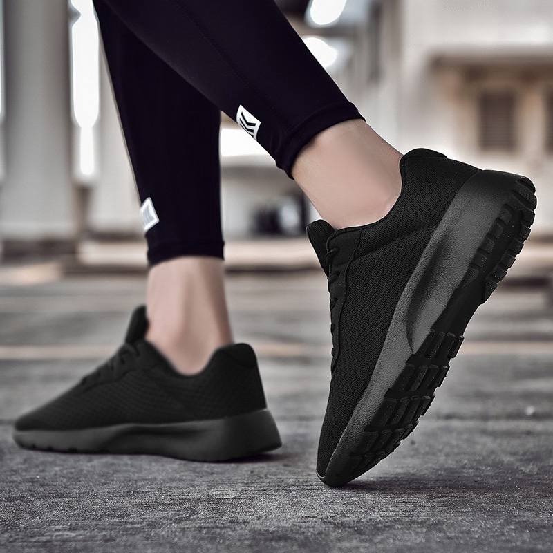 black sneakers with black soles
