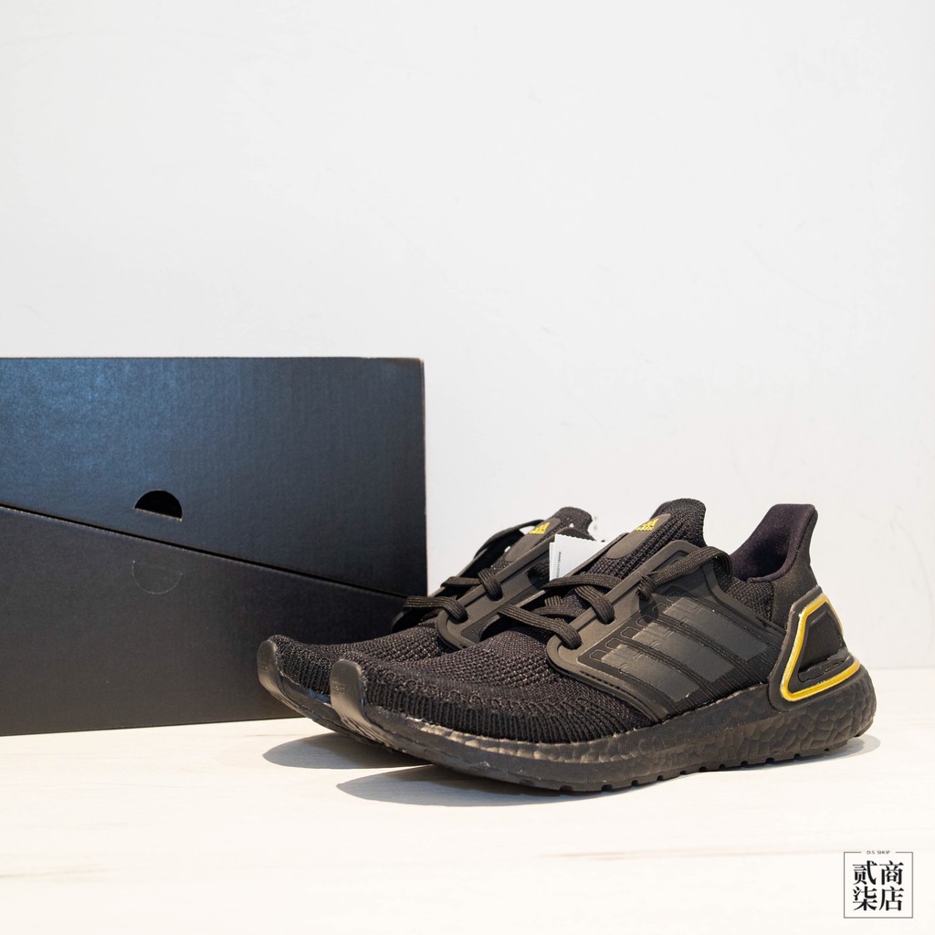 gold and black running shoes