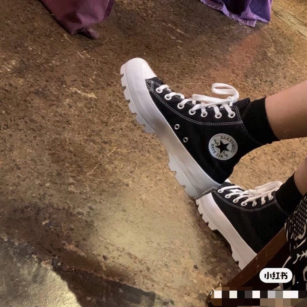 black converse lugged high top