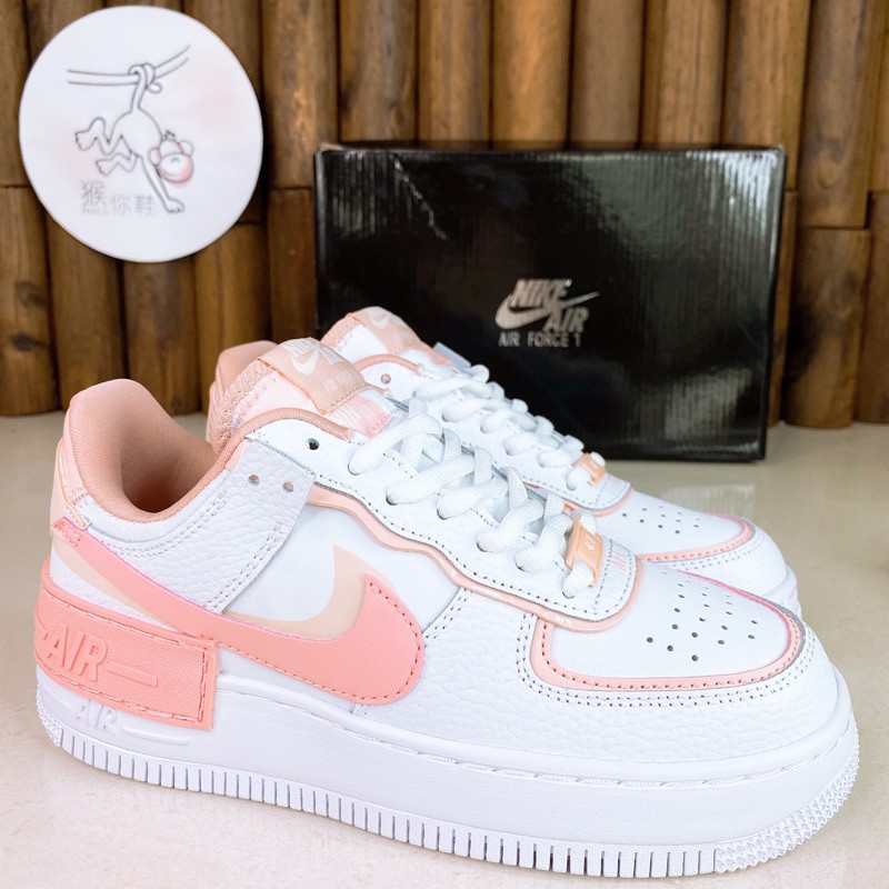 peach and white nike shoes